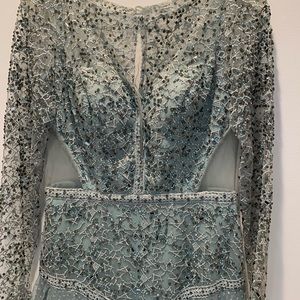 Prom/evening dress in seafoam green. Sheer cutout, sheer back and sleeves.